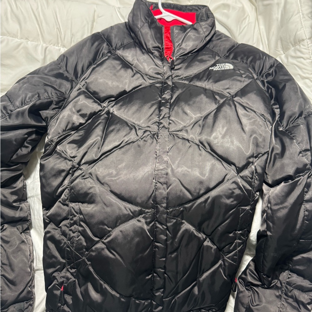 The North Face Women's Black Jacket with Red Details.